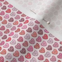 (micro scale) heart shaped donuts - valentines red and pink on light pink