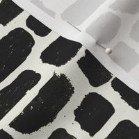 black paint daubs on cream black paint strokes on cream ivory