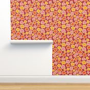 Yellow, pink, red, and orange doodle flowers on a purple background