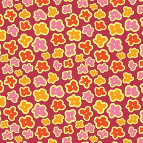 Yellow, pink, red, and orange doodle flowers on a purple background