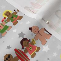 Gingerbread men and women on a gray background with stars. Gingerbread surfer. Gingerbread hula girl. Fun Christmas print.