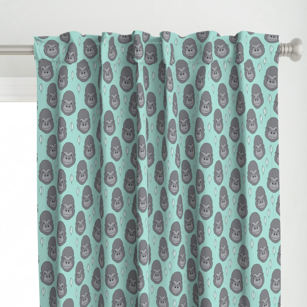 gorillas and leaves on teal