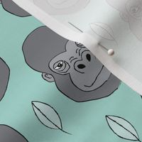 gorillas and leaves on teal