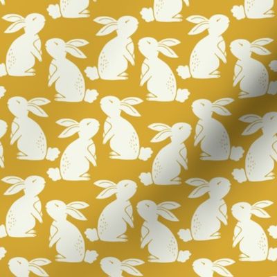 White bunny rabbits in yellow gold 