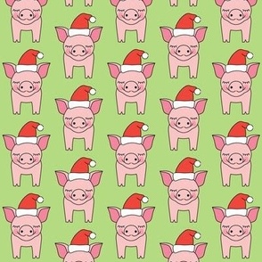 pigs and santa hats on green