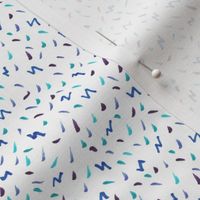Dots, Dashes and Squiggles in Blue and Purple Illustrated Pattern on White Background