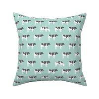 cows on dark mint - farm fabric