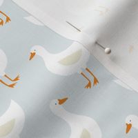 Geese on light cloudy blue