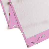 paper airplane dog fighters on pink