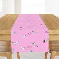 paper airplane dog fighters on pink