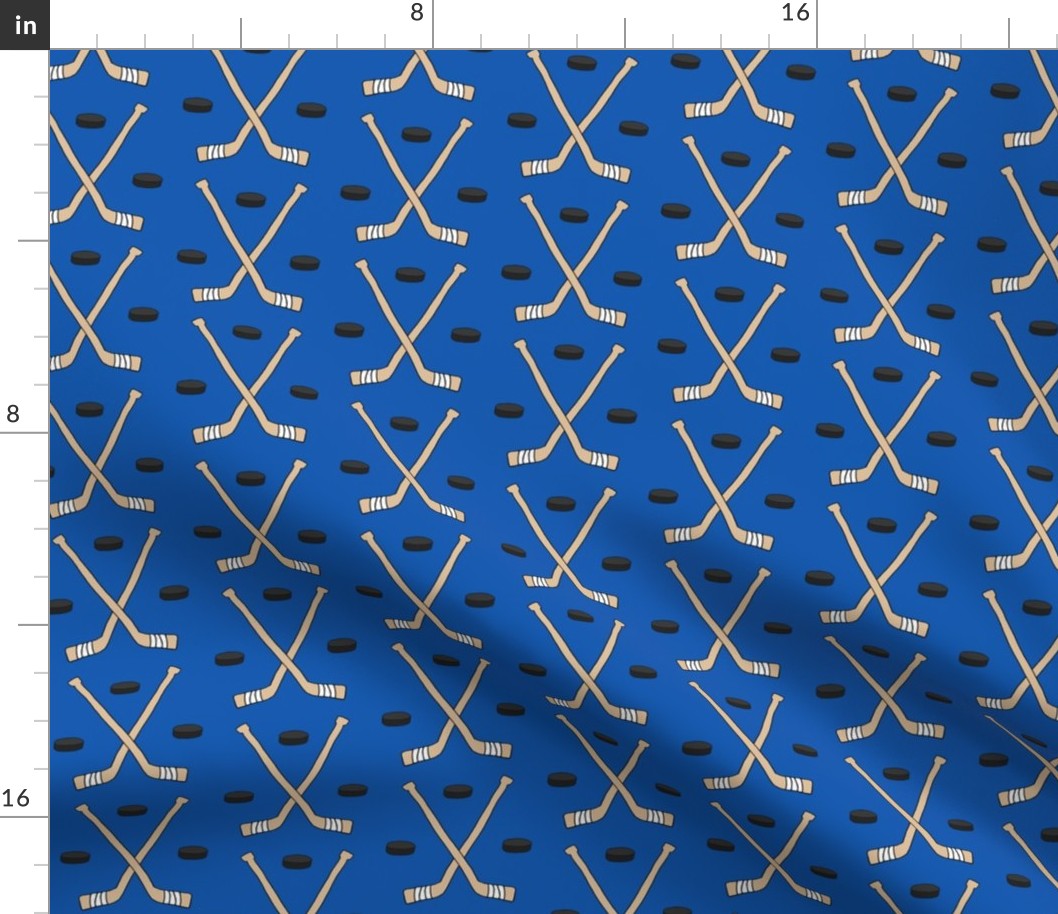 Hockey Sticks and Pucks on Blue - larger