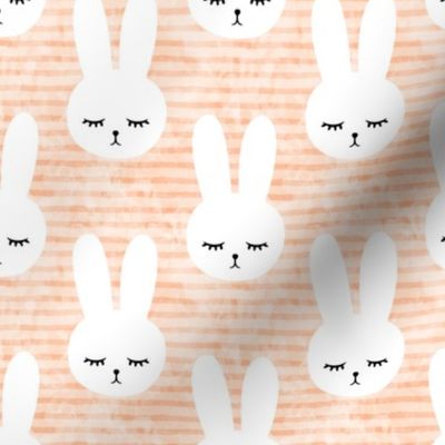 bunnies on peach (sleepy bunny)