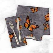 Monarch Butterflies in Color on Gray Granite