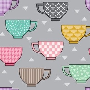 teacups with patterns on grey