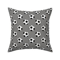 soccer balls on grey