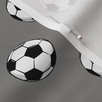 soccer balls on grey