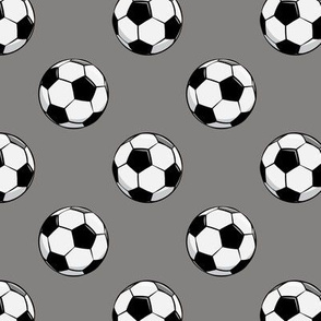 soccer balls on grey
