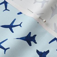 Watercolor airplanes on blue