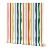 Organic Rainbow Stripe Design: colorful imperfect vertical stripes on cream background.