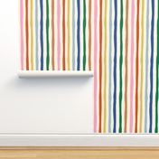 Organic Rainbow Stripe Design: colorful imperfect vertical stripes on cream background.