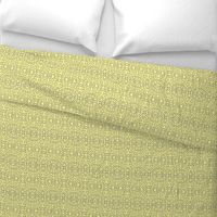 A Lacy Mesh of Twinkling Dots on Buttery Yellow