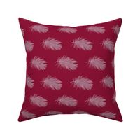 white feather on cranberry red