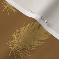 gold feather on caramel brown