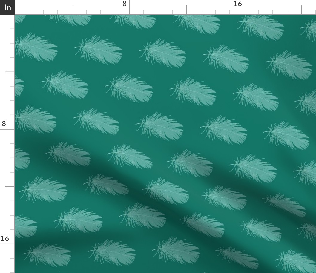pale blue feather on spruce green