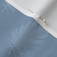 light blue feather on denim