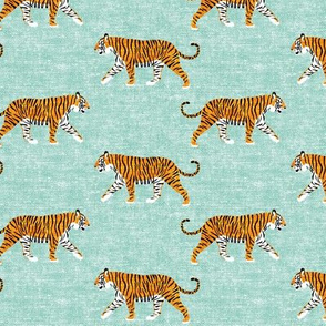 walking tiger on dark mint (woven)