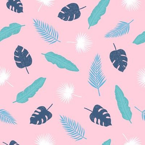 Tropical leaves on pink background