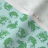 small serene frogs - green on light blue