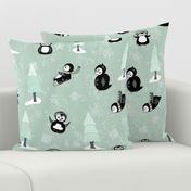 Playful Penguins on Mint Green