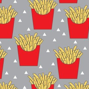 french fries with red box on dark grey