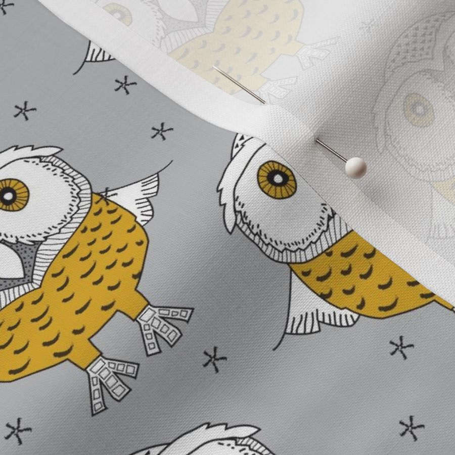 wise gold owls on grey