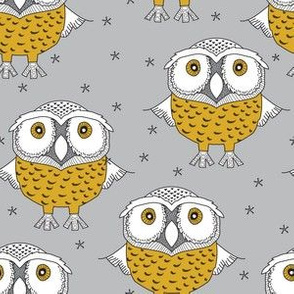 wise gold owls on grey