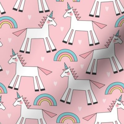 pastel unicorns rainbows and hearts on pink