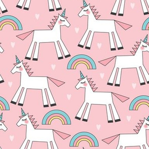 pastel unicorns rainbows and hearts on pink