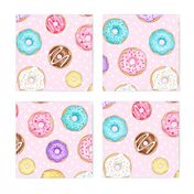 Scattered Rainbow Donuts on pale spotty pink - large scale