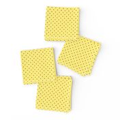 Tiny brown polka dots on yellow