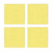 Tiny brown polka dots on yellow