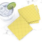 Tiny brown polka dots on yellow