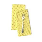 Tiny brown polka dots on yellow