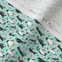 Tiny Watercolor Penguins with little Teal Fish on Mint