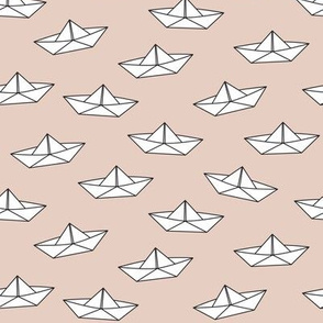 paper boats on brown