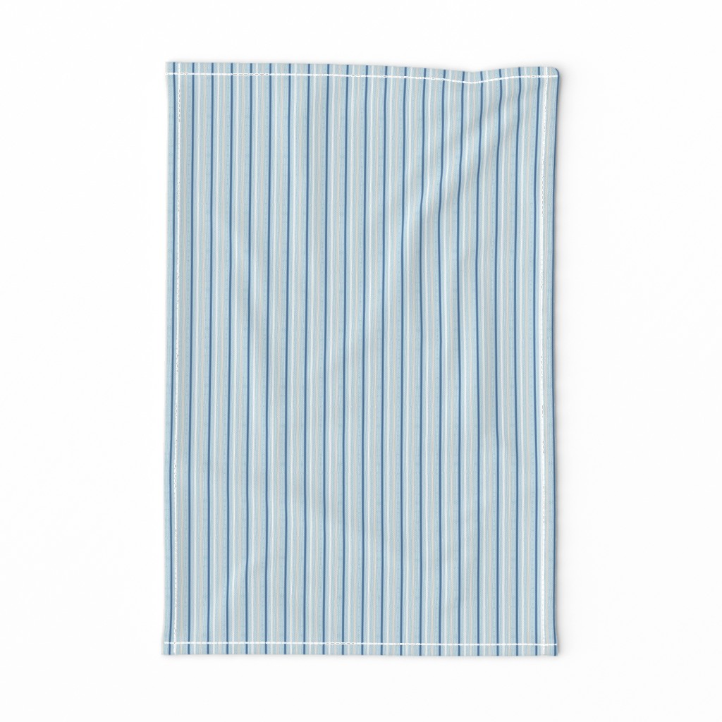 thin vertical blue and yellow stripes on textured light blue | small