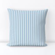 thin vertical blue and yellow stripes on textured light blue | small