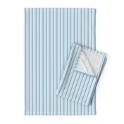 thin vertical blue and yellow stripes on textured light blue | small