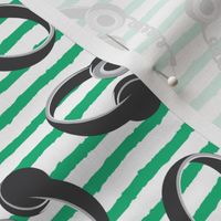 headphones on dark green stripes