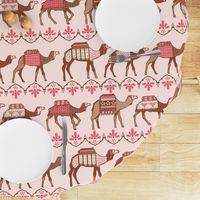 Marrakesh camels in a line pink and brown